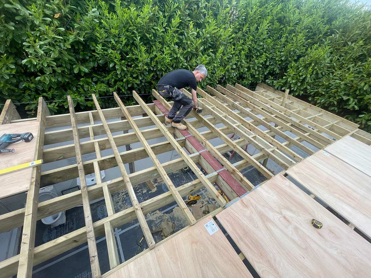 Roof joists being set out on a new single-storey extension in Hertfordshire