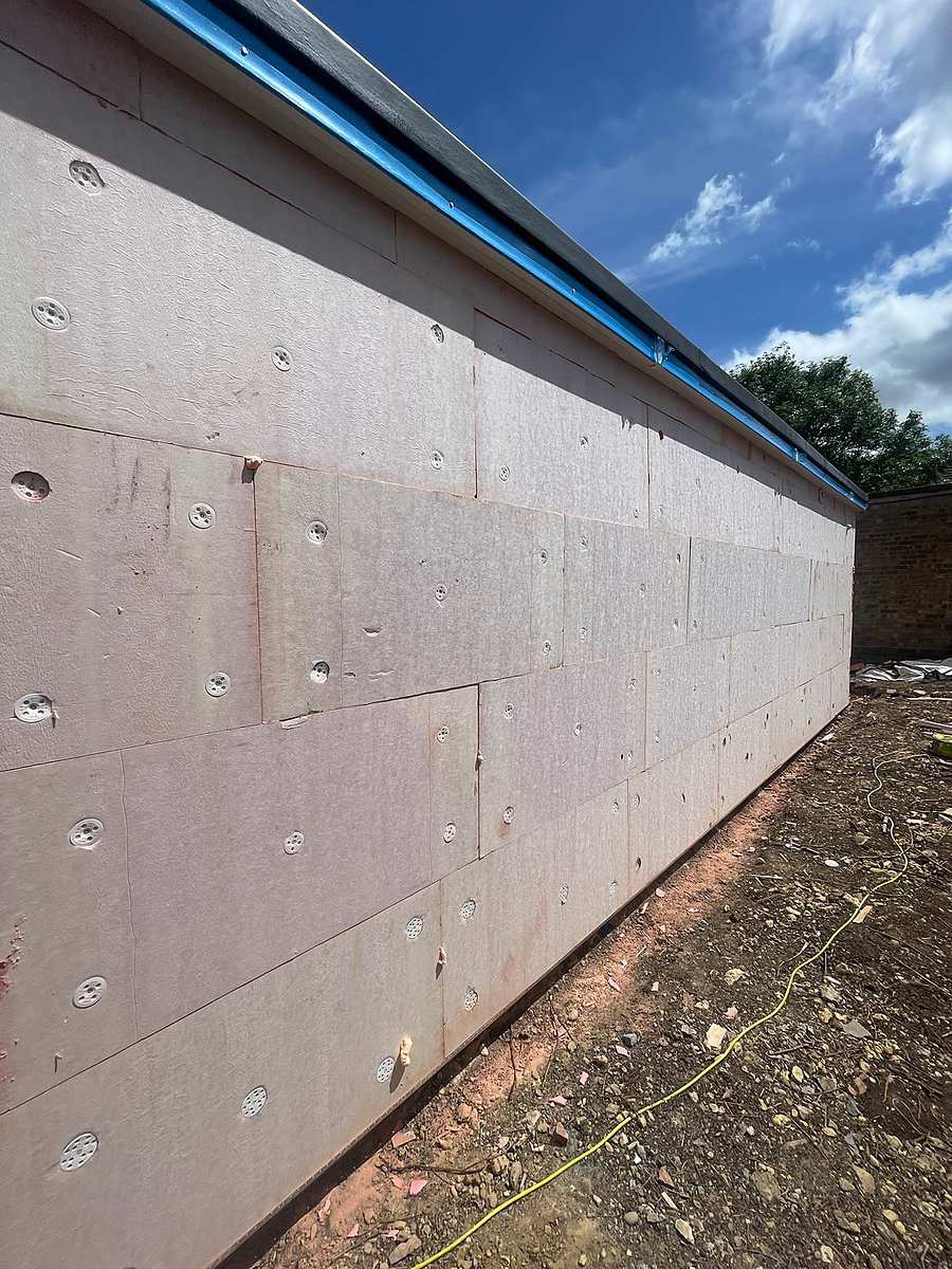 New blockwork going up near a boundary on a Hertfordshire extension