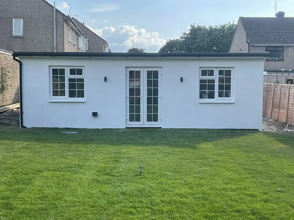 Rendered summer house with French doors and a new lawn