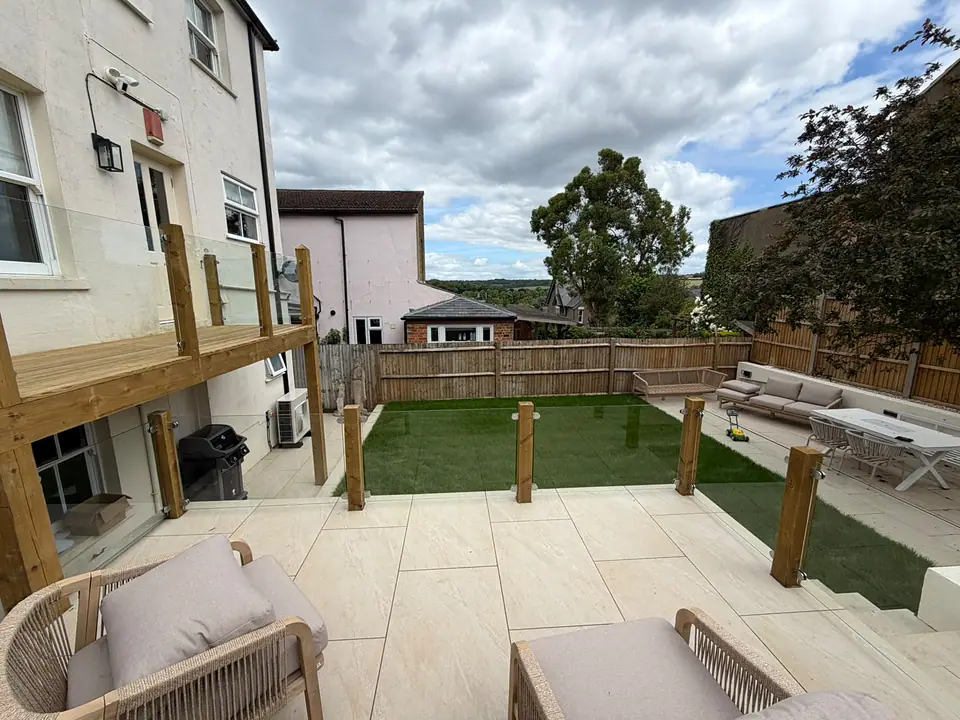 Garden landscaping with a porcelain terrace in Berkhamsted by Dacorum Builders